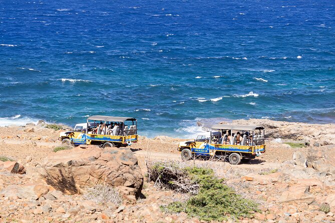 Aruba Cave Pool and Secret Beach Safari Tour - Getting Oranjestad picked up for an off-road day