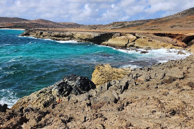 Aruba EZ Raider North Coast Ultimate Adventure - Ayo Rock Formation: boulders, a path, and old drawings