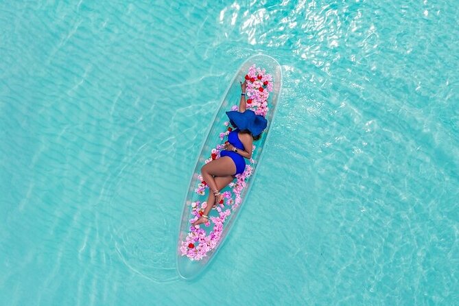 Aruba‘s #1 Clear Kayak INSTANT DELIVERY@arubaphotoshootexperience - Stepping into the LUX floral clear kayak on Aruba’s clear water