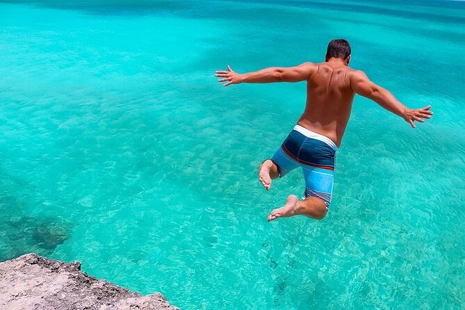 Colorful Beach Bus Sightseeing Tour of Aruba - Cave Pool Aruba: crystal-clear water and careful choices