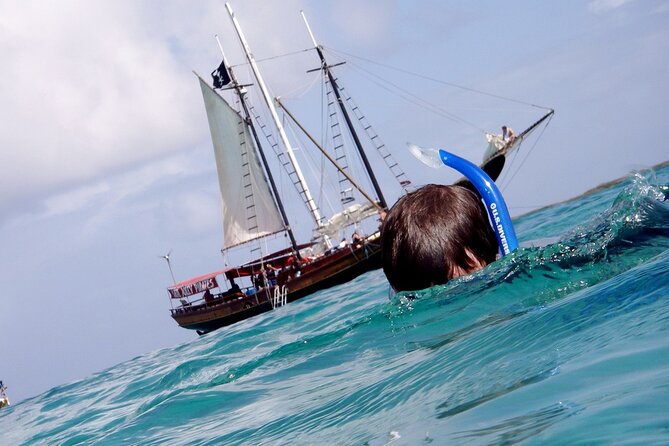 Set Sail in Aruba: Jolly Pirate Cruise with Snorkel Adventure - SS Antilla Wreck Snorkeling: WWII Masts Above the Water